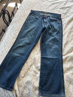 Wrangler Blue Denim Boot Cut Jeans with Tan Stitching